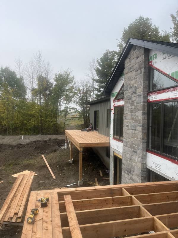 Covered deck being framed on a new custom home