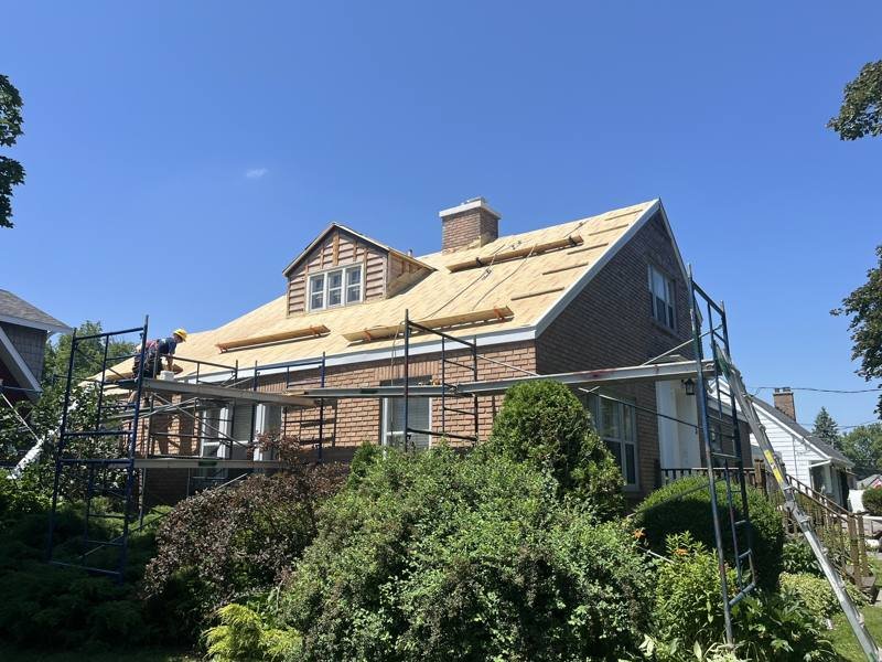 Roof re-sheathing on a brick two-storey home