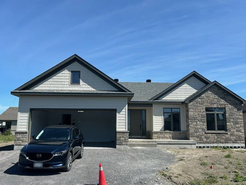 New bungalow with stone and shake siding